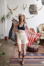 Load image into Gallery viewer, Seamless lace blue bralette with racerback design, perfect for layering.